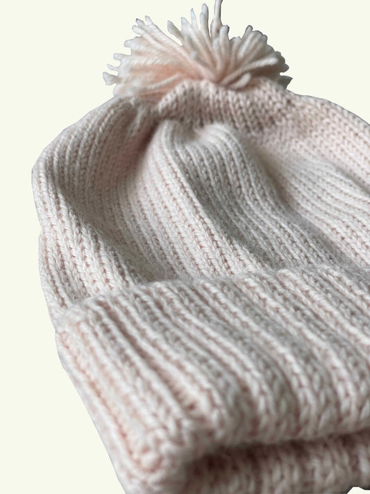 Baby knitted hat in colour pink