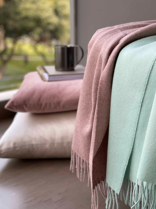 Blanket from alpaca wool in pink mint colors